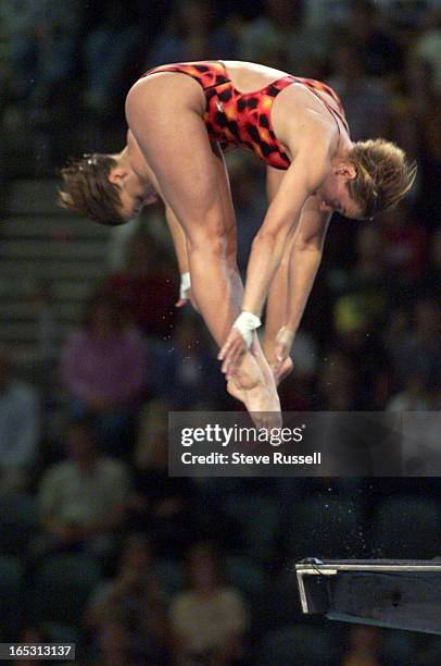 Fancy-9/27/2000---Canada's Emilie Heymans, right and Anne Montminy perform one of the five dives that scored them high enough to win silver at the...