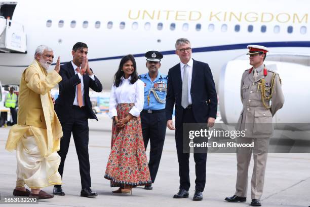 Prime Minister Rishi Sunak and his wife Akshata Murty are met on the tarmac by dignitaries including the Indian Minister of State and Alex Ellis, the...