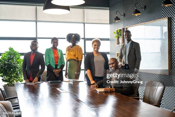 portrait of nairobi business team in modern board room - kenya business stock pictures, royalty-free photos & images