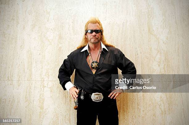 Dog the Bounty Hunter Dog the Bounty Hunter poses for a photograph at the Four Seasons Hotel while in town promoting his book, You Can Run But You...
