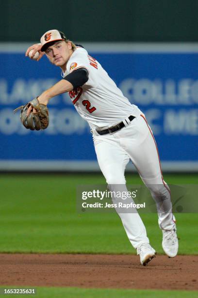 Gunnar Henderson of the Baltimore Orioles throws out Danny Jansen of the Toronto Blue Jays at first base during the fifth inning at Oriole Park at...