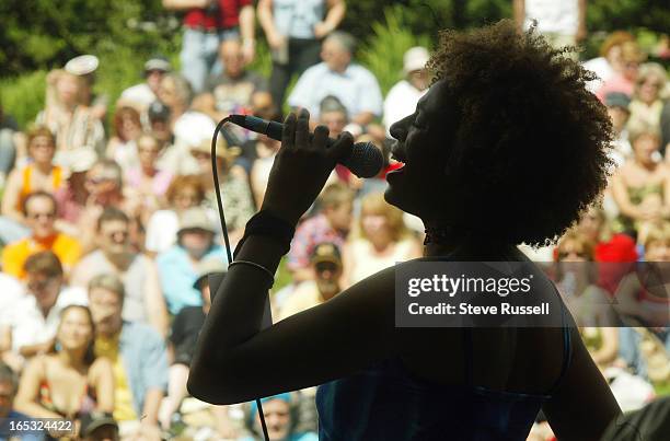 Sarkura S'Aida belts out "Don't Freeze on Me" to a crowded park as she and Bill King's Saturday Nite Fish Fry play the last day at the Main stage at...