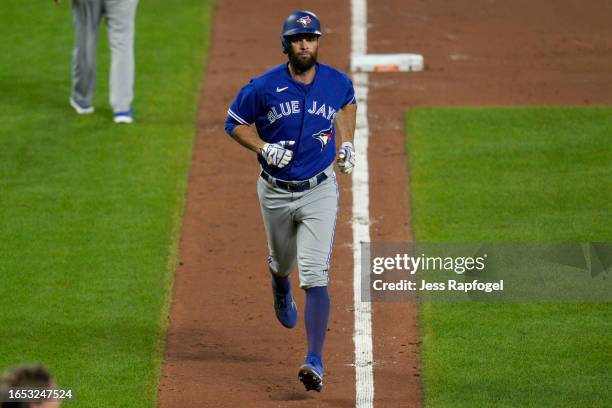Brandon Belt of the Toronto Blue Jays runs the bases after he hits a home run against the Baltimore Orioles during the sixth inning at Oriole Park at...