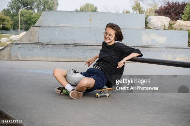 pure joy: the radiant smile of a skateboarder - winnipeg park stock pictures, royalty-free photos & images