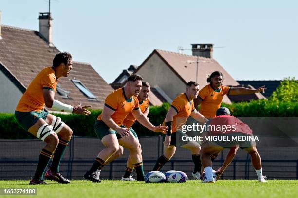 Australia's lock Matt Philip , Australia's prop Blake Schoupp , Australia's Angus Bell and Australia's flanker Rob Leota attend a 'Captain's Run'...