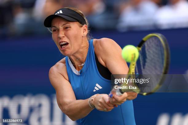 Caroline Wozniacki of Denmark returns a shot against Jennifer Brady of the United States during their Women's Singles Third Round match on Day Five...