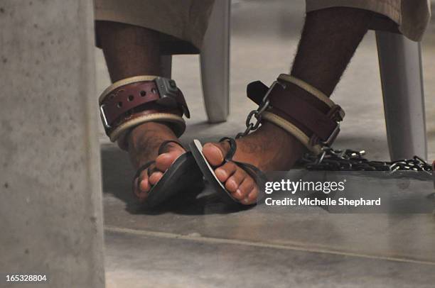 In this April 27, 2010 photo reviewed by a Department of Defense official, a detainee is shackled as he attends a "Life Skills" class. Attention...