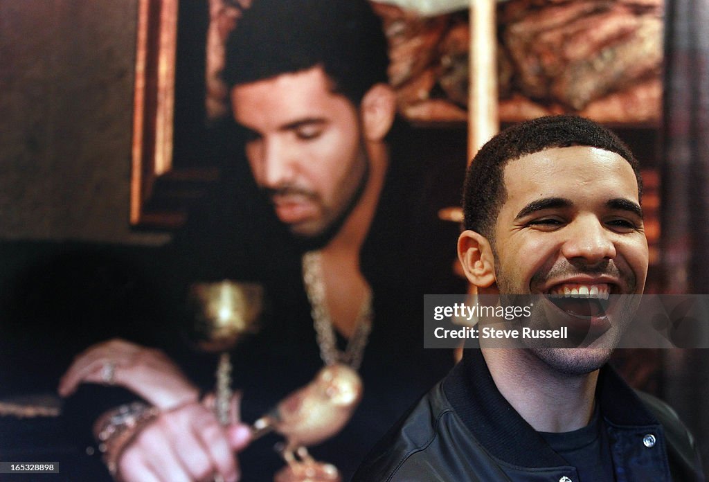 Drake signs autographs for the first 500 fans that ordered his new album "Take Care" at the Queen St