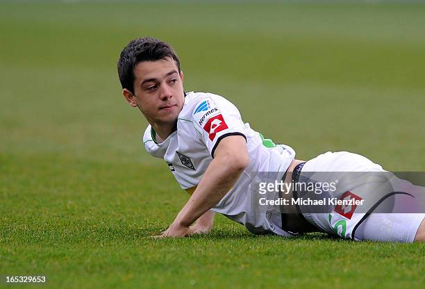 Amin Younes of Gladbach lies on the pitch during the Bundesliga match between SC Freiburg and VfL Borussia Moenchengladbach at MAGE SOLAR Stadium on...