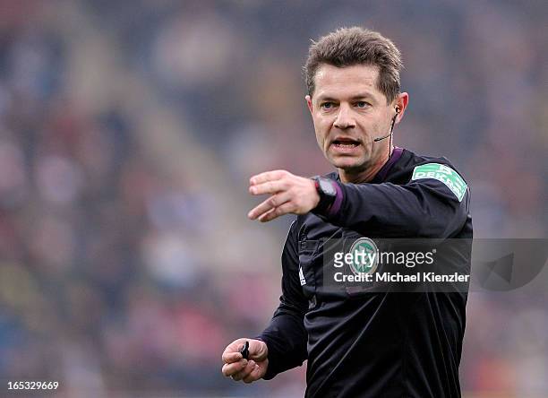 Referee Guenter Perl reacts during the Bundesliga match between SC Freiburg and VfL Borussia Moenchengladbach at MAGE SOLAR Stadium on March 30, 2013...