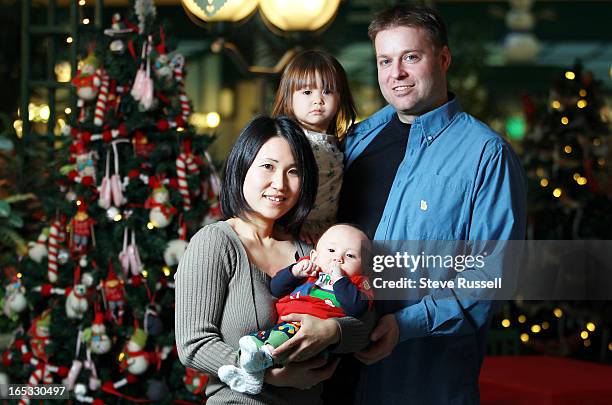 Kaito held by mom, Tamami Suzuki and with dad Charles Kryvenchuk and sister Reina, 2. This will be the first Christmas for baby Kaito, who was born...