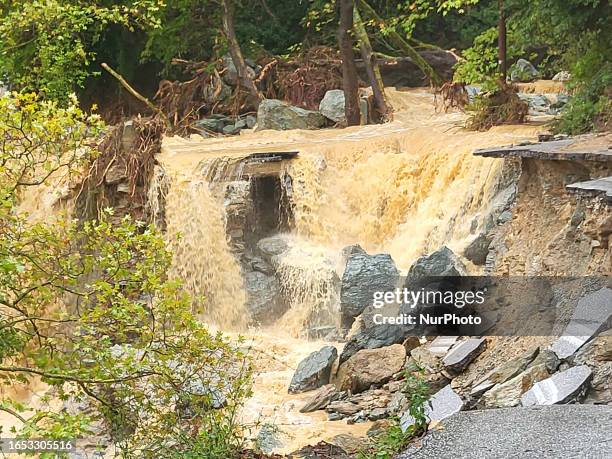 Pelion Mountain hit by the fierce rainstorm causing damage or vanishing the road network and houses collapsing in landslides while trapped people are...