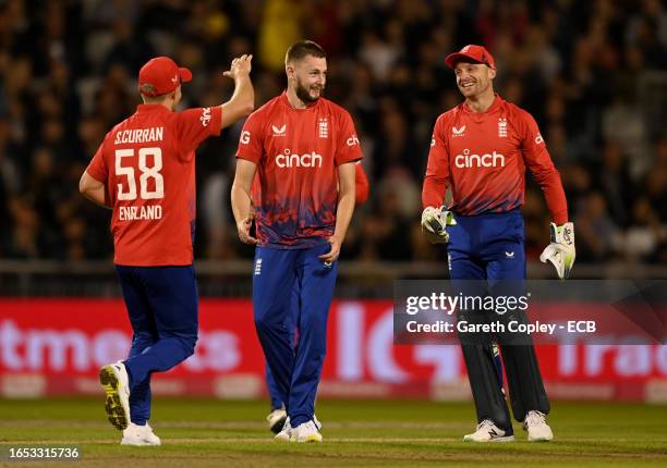 Gus Atkinson of England celebrates with Jos Buttler after dismissing Tim Seifert of New Zealand during the 2nd Vitality T20 International between...