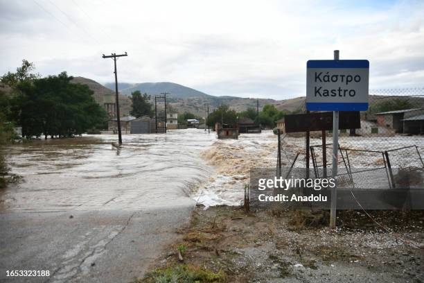 View of a flooded street as heavy machines try to clean the roads after heavy rain in Thessaly, Greece on September 7, 2023.