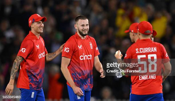 England bowler Gus Atkinson celebrates with team mates after bowling New Zealand batsman Lockie Ferguson to win the game during the 2nd Vitality T20I...