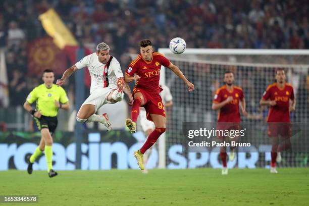 Theo Hernandez of AC Milan is challenged by Stephan El Shaarawy of AS Roma during the Serie A TIM match between AS Roma and AC Milan at Stadio...