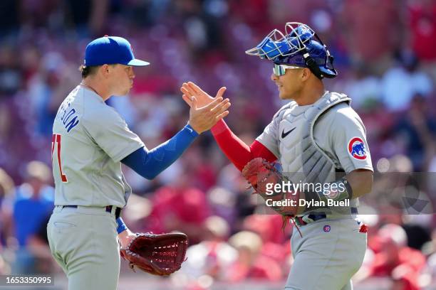 Keegan Thompson and Miguel Amaya of the Chicago Cubs celebrate after beating the Cincinnati Reds 6-2 during game one of a doubleheader at Great...