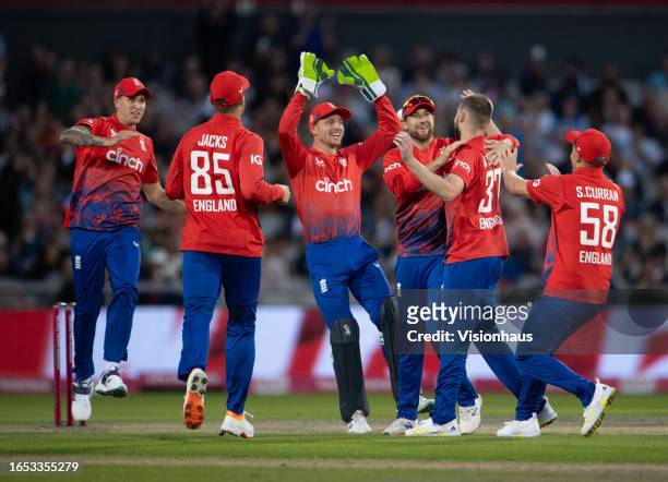 England players celebrate with Gus Atkinson after he takes the wicket of Devon Conway of New Zealand during the 2nd Vitality T20I match between...