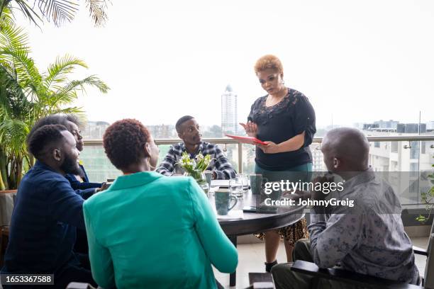 project manager discussing developments with team - nairobi county stock pictures, royalty-free photos & images