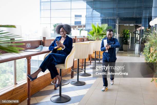 mid adult business people in open-air atrium - nairobi county stock pictures, royalty-free photos & images