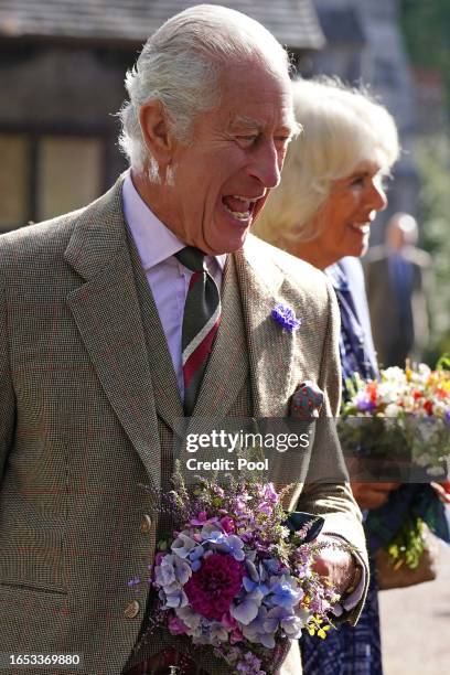 King Charles III and Queen Camilla meet estate staff and members of the public as they depart Crathie Parish Church following a church service to...