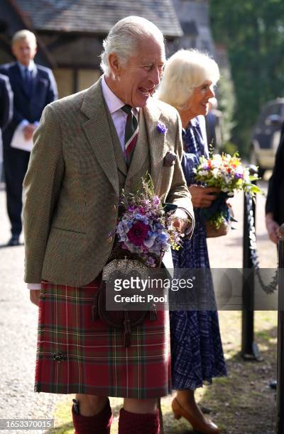 King Charles III and Queen Camilla meet estate staff and members of the public as they depart Crathie Parish Church following a church service to...