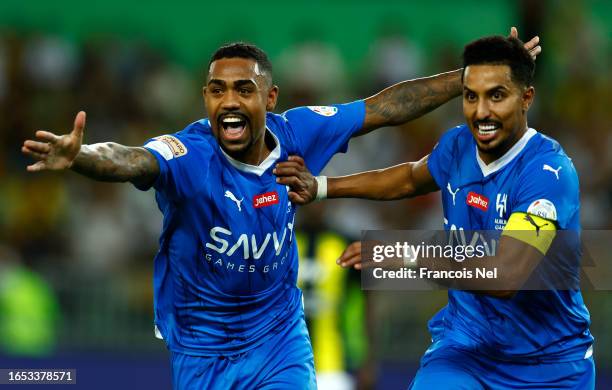 Malcom of Al Hilal Club and Salem Al Dawsari of Al Hilal Club celebrate after scoring the their teams third goal during the Saudi Pro League match...