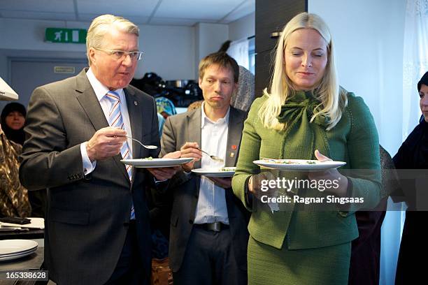The Mayor of Oslo Fabian Stang and Princess Mette-Marit of Norway visit the Church City Mission on April 3, 2013 in Oslo, Norway.