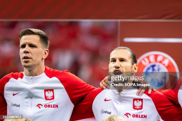 Wojciech Szczesny and Grzegorz Krychowiak of Poland singing the national anthem during the UEFA EURO 2024 qualifying match between Poland and Faroe...