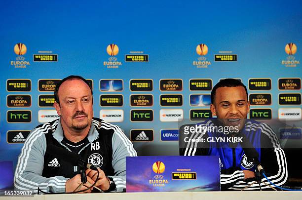 Chelsea's Spanish interim manager Rafael Benitez listens as English defender Ryan Bertrand talks during a press conference for the forthcoming UEFA...