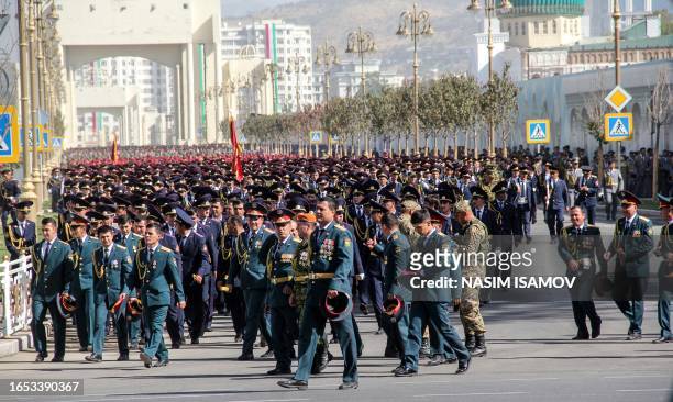 Tajik servicemen walk a after a military parade marking the country's Independence Day celebrations, in central Dushanbe on September 8, 2023.