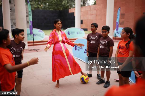 Akshata Murty plays football with local schoolchildren at the British Council during an official visit ahead of the G20 Summit, on September 8, 2023...