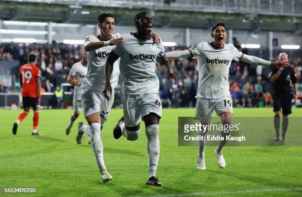 Kurt Zouma of West Ham United celebrates after scoring the team's second goal during the Premier League match between Luton Town and West Ham United...