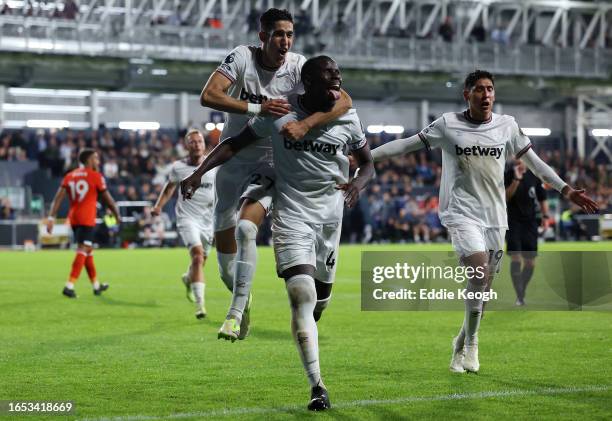 Kurt Zouma of West Ham United celebrates after scoring the team's second goal during the Premier League match between Luton Town and West Ham United...