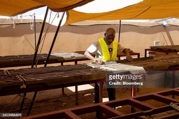 Worker checks geological samples in a storage area on the Khnaiguiyah mining site in Khnaiguiyah, Saudi Arabia, on Monday, July 2023. Saudi Arabia's...