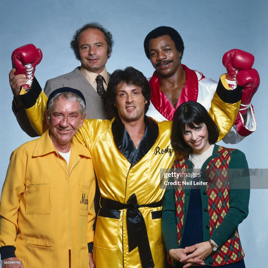 Portrait of Sylvester Stallone, as Rocky Balboa, with the cast of