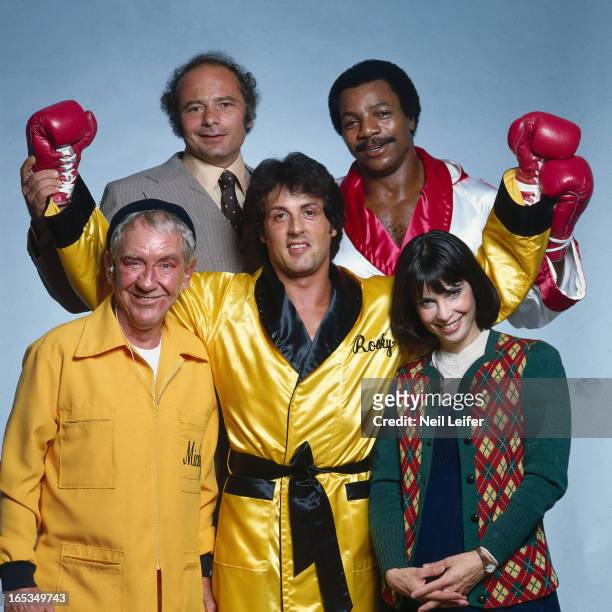 Portrait of Sylvester Stallone, as Rocky Balboa, with the cast of "Rocky II" movie. Burgess Meredith as Mickey Goldmill, Burt Young as Paulie, Carl...