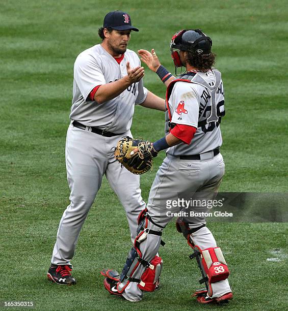 Boston Red Sox closer Joel Hanrahan celebrates the win with Boston Red Sox catcher Jarrod Saltalamacchia . The Boston Red Sox play the New York...