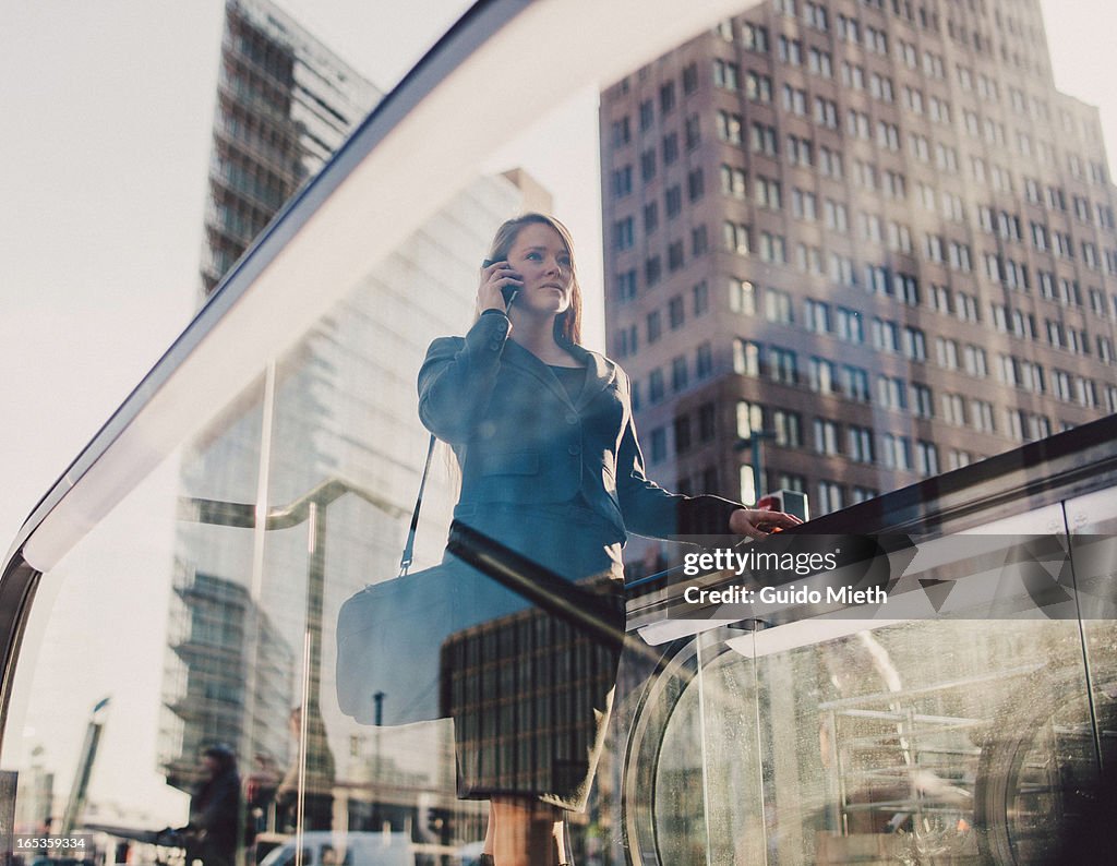 Businesswoman using smart device.