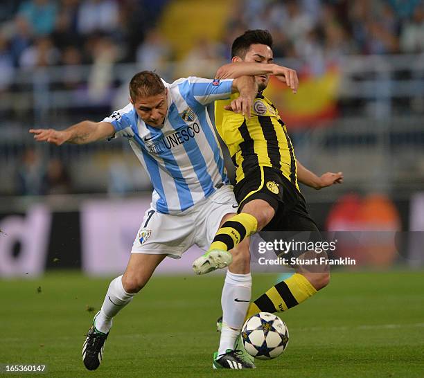 Ilkay Gündogan of Dortmund challenges for the ball with Joaquín of Malaga during the UEFA Champion League quarter final first leg match between...