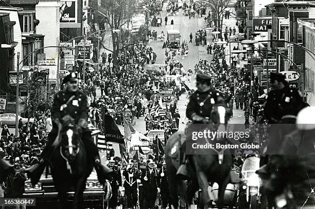 Boston's Mounted Police Unit leads the parade up East Broadway. A highlight of the 1974 parade was a team of eight Anheuser-Busch Clydesdale horses...