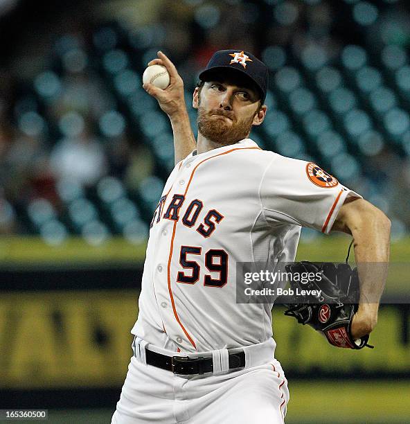 Philip Humber of the Houston Astros pitches against the Texas Rangers in the first inning at Minute Maid Park on April 3, 2013 in Houston, Texas.