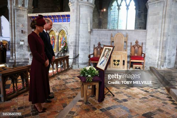 Britain's Prince William, Prince of Wales and Britain's Catherine, Princess of Wales visit St David's Cathedral in south-west Wales on September 8 to...