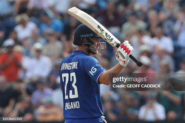 England's Liam Livingstone reacts to reaching his half century during the first One Day International cricket match between England and New Zealand...