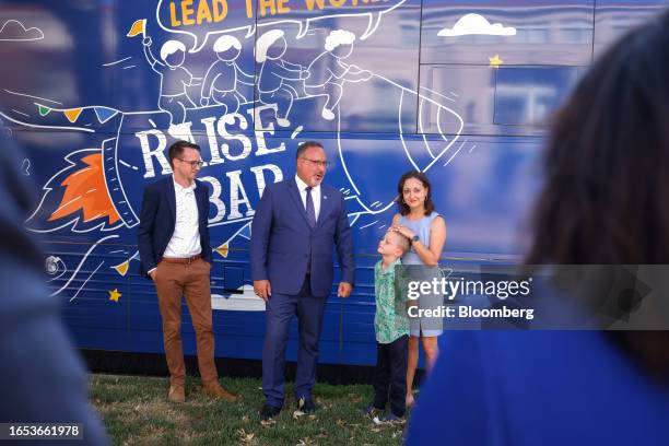 Miguel Cardona, US secretary of education, center, introduces the 2023 National Teacher of the Year, Rebecka Peterson, right, and her family at the...