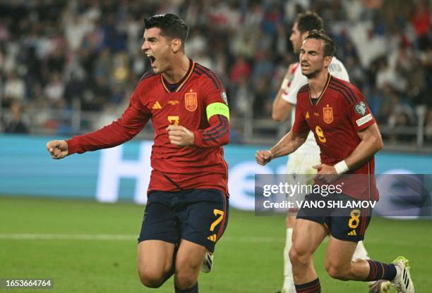 Spain's forward Alvaro Morata and Spain's midfielder Fabian Ruiz celebrate a goal during the UEFA Euro 2024 qualifying first round group A football...