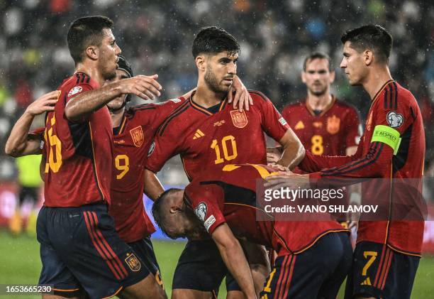 Spain's midfielder Marco Asensio and teammates celebrate a goal during the UEFA Euro 2024 qualifying first round group A football match between...