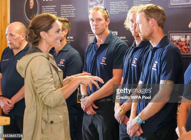 Britain's Prince William, Prince of Wales and Catherine, Princess of Wales visit the RNLI LifeBoat Station at St Davids where they met crew,...