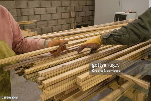 Workers sort wood pieces at the Center for Technological Woodworking Development in Machagai, Chaco province, Argentina, on Wednesday, Sept. 6, 2023....