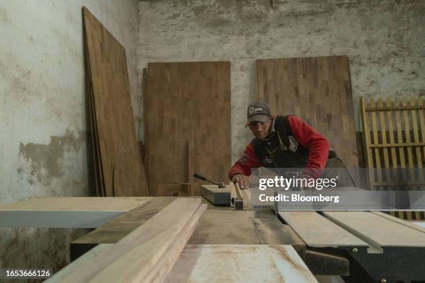 Worker cuts finger joint wood boards at a woodshop in Machagai, Chaco province, Argentina, on Wednesday, Sept. 6, 2023. The majority state-owned...